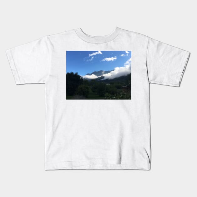 Blanket of clouds Kids T-Shirt by Dturner29